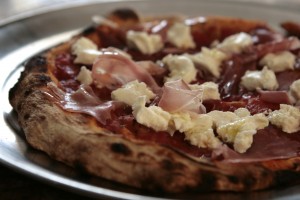 As the warmth from the pizza comes up it slowly melts the bottom of the mozzarella, but the top remains cool.