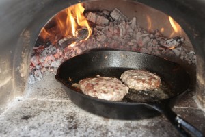 Toss a couple burgers into the Lodge Cast Iron pan. 