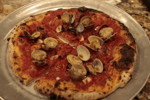 You have to place the whole clams on the pizza after you cut it to serve. 