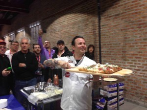 Tony Gemignani serving one of his Sicilian pizza masterpieces