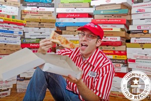 Scott, surrounded by his beloved pizza boxes!