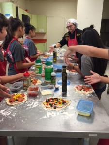 Albert Grande sharing his pizza passion with young Hawaiians.