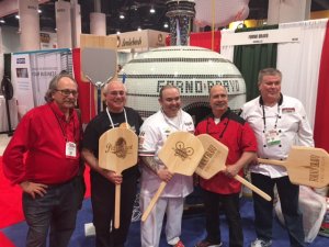 That's pizza champion Leo Spizzirri in the center, following one of his five demo's, flanked by a few of his fans. 