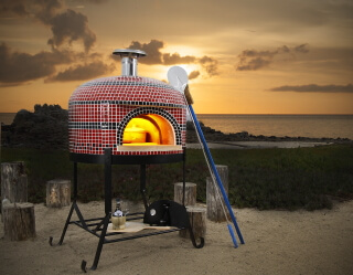 Forno Bravo Napolino Pizza Oven with red and black tile on the beach in California.