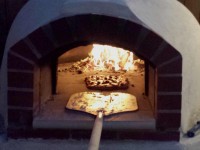 Giardino Pizza Oven with Pizza and Fire