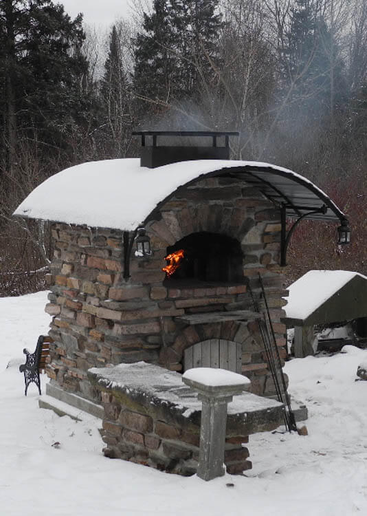 outdoor pizza oven winter snow