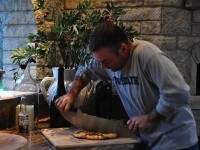 Cutting Pizza with Premio Pizza Oven in Background - Weedville PA