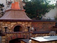 Casa modular pizza oven kit with stone veneer and oriental style roof