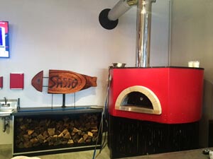 red Professionale commercial pizza oven in restaurant