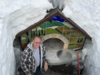 Man in front of pizza oven buried in 12 feet of snow