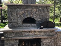 Stone Enclosed Casa pizza oven and wood storage