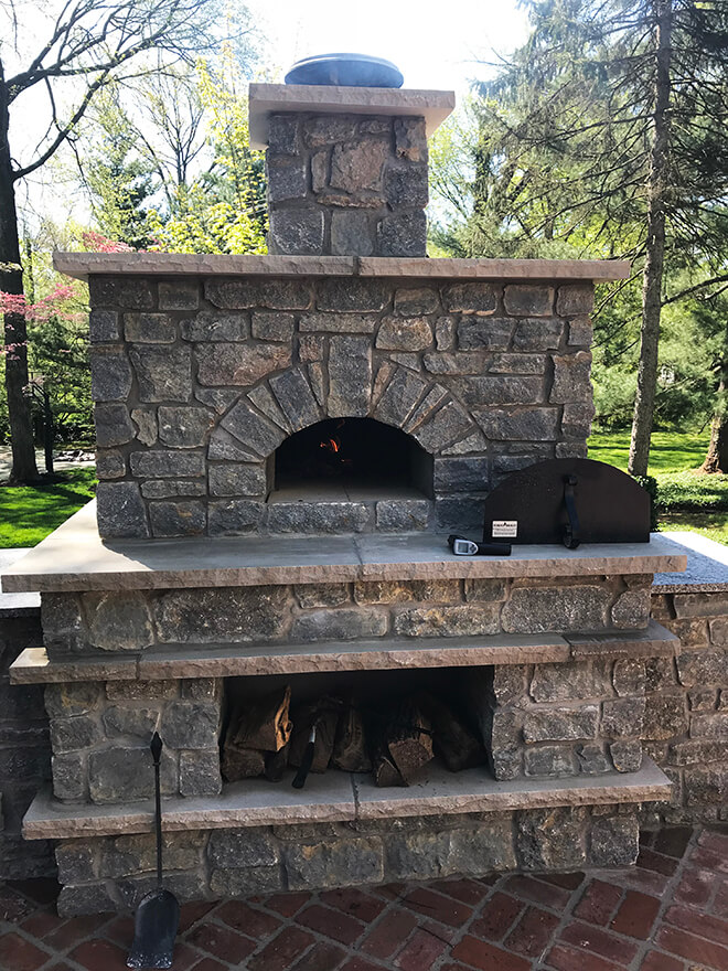 Stone Enclosed Casa pizza oven and wood storage