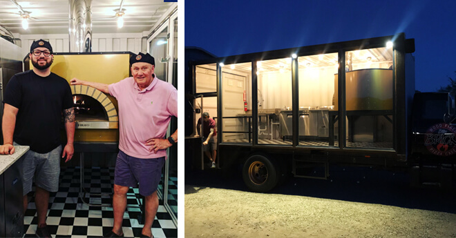 Two men infront of an oven-Food truck at night