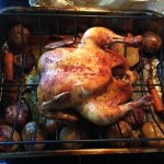 Wood Fired Chicken and vegetables roasting on a rack