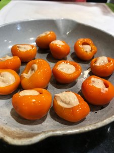 Plate of peppadew peppers filled with cream mixture