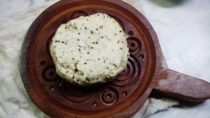 White Eid Bread Dough Ball on Brown Wooden Mold