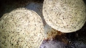 Uncooked Eid dough with circle patterns on top