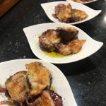 Fire Roasted Figs and Spanish Cheese in fluted square plates
