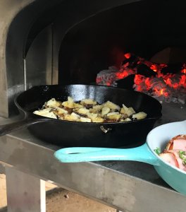 Cast iron pan of figs and cheese in the mouth of a Bella Grande32 wood fired oven