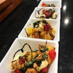 Wood Fired Peach Caprese Salad in white square bowls