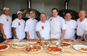 5 men - table of pizzas