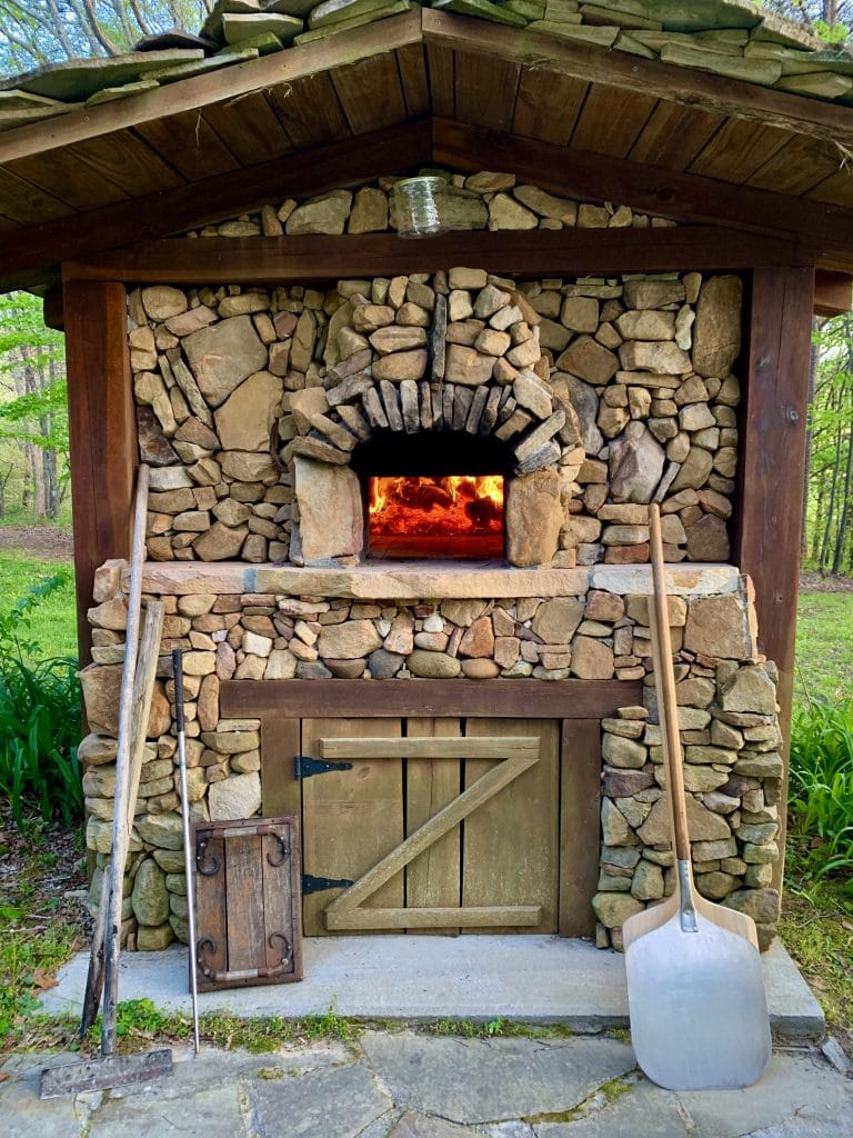 Pompeii brick oven with stone enclosure