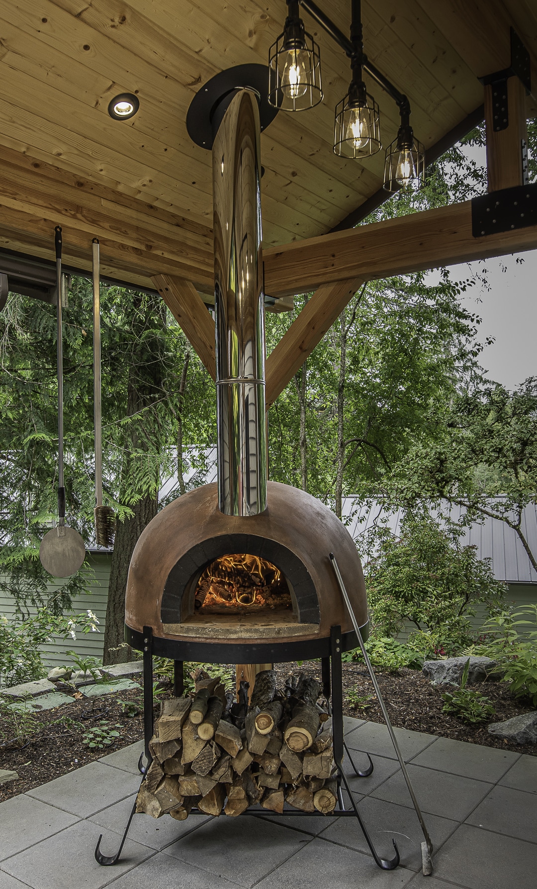 pizza oven in front of trees