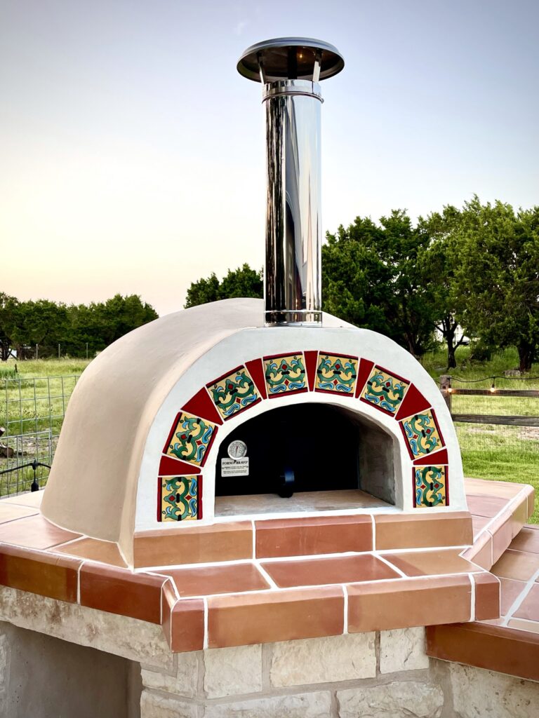 cream stucco oven with tile and terracotta face