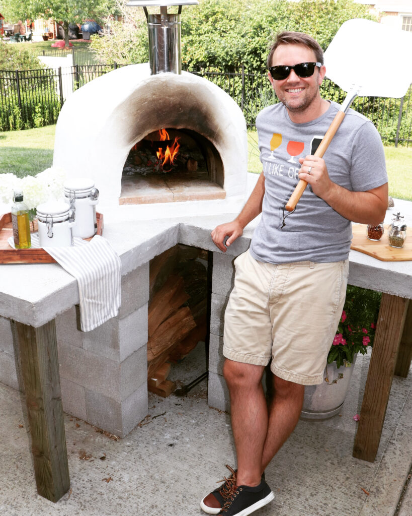 man-white pizza oven-fire