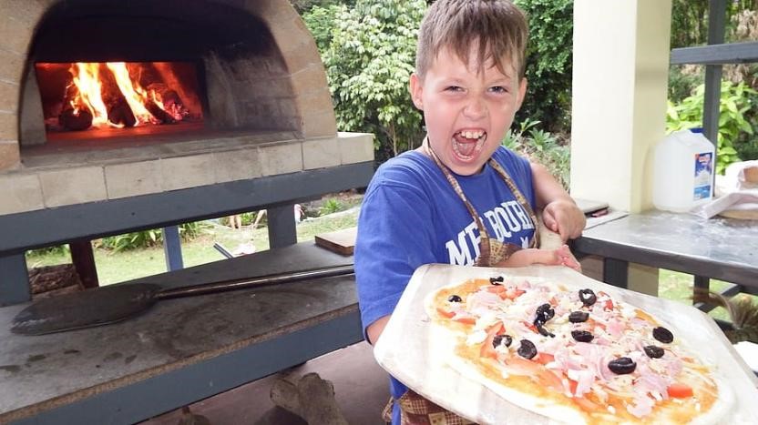 child yelling- holding pizza on peel