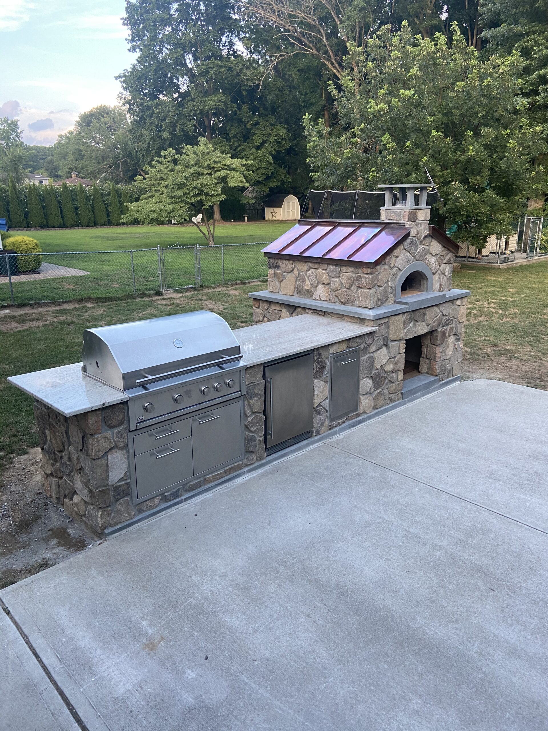 Stone Grill Island with Built-in Gas fired Pizza Oven