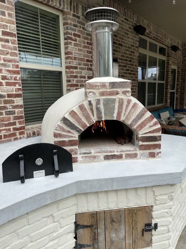 Brick arch-steel door-wood fired pizza oven