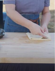 hands folding pie crust