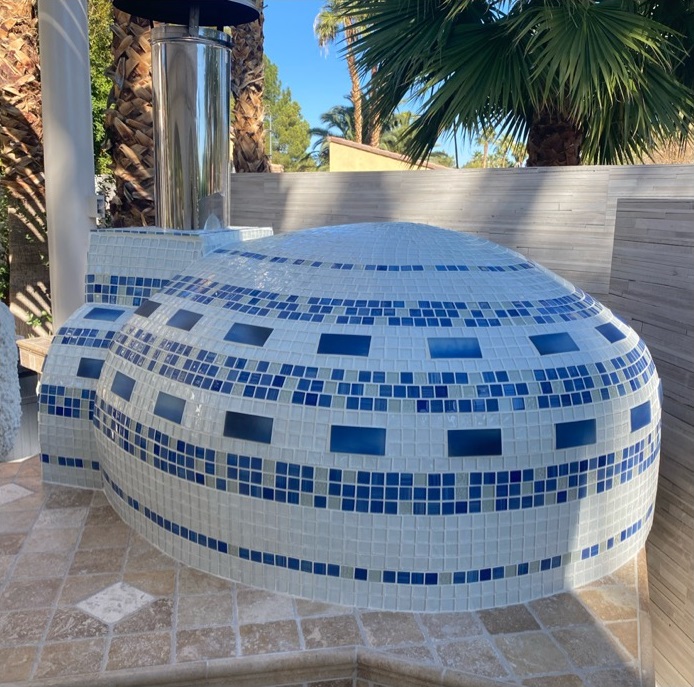 pizza oven with white and blue tile-back