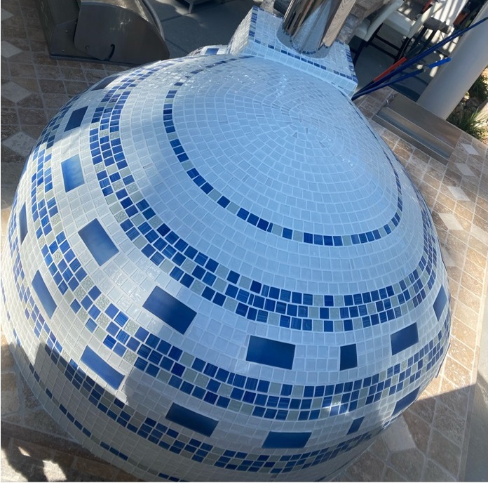 pizza oven with white and blue tile-top