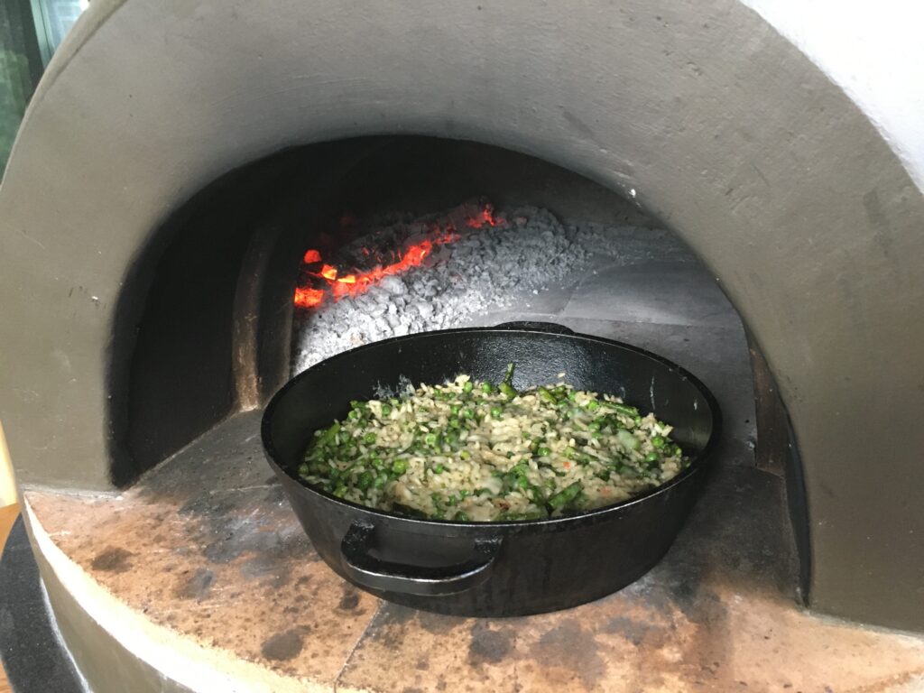 rissotto in cast iron pan-wood fired oven