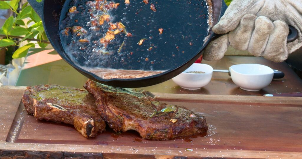 cast iron skillet-sauce-cooked steaks