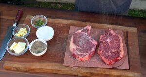 Steak and spices on cutting board